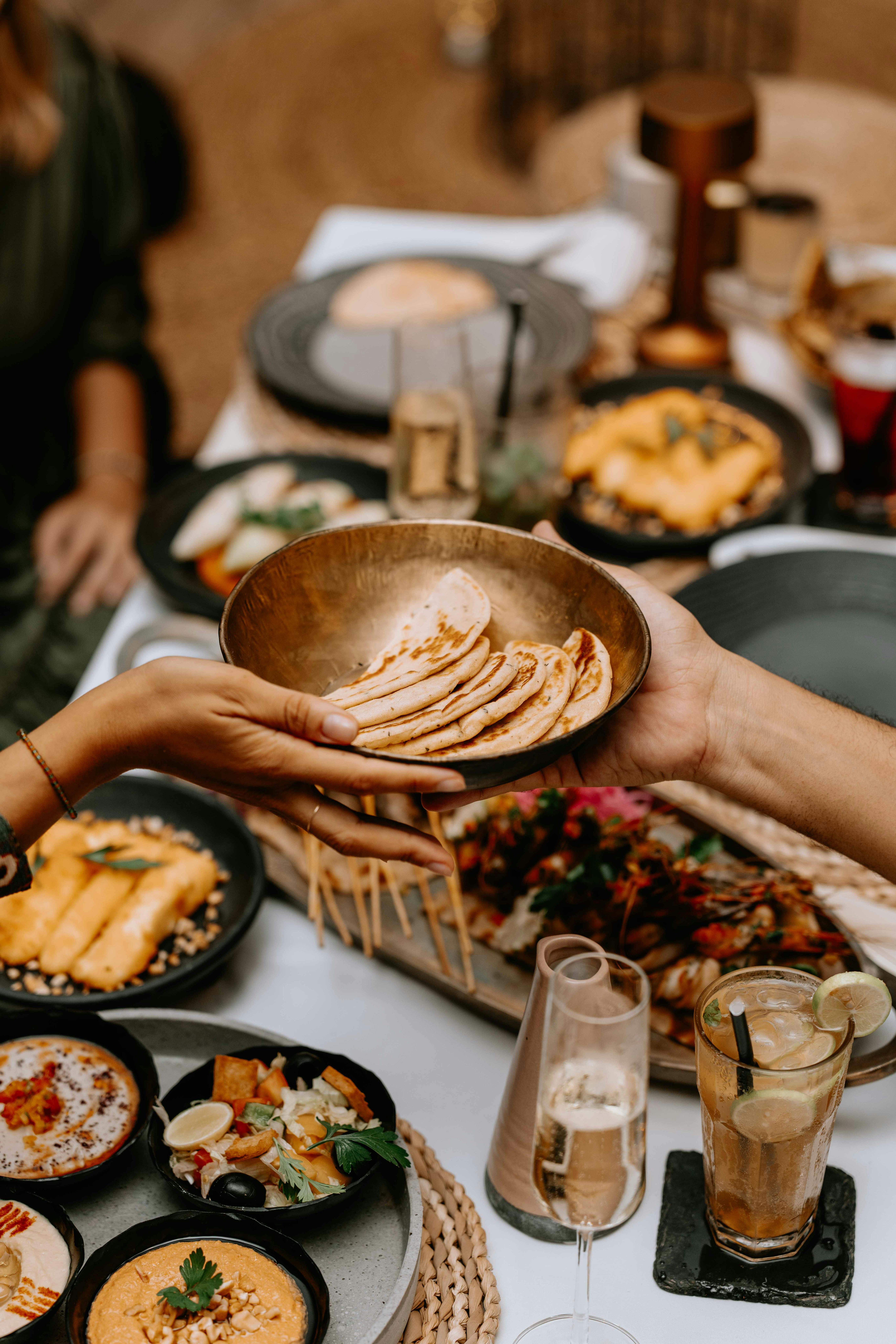 A bowl of pumpkin soup garnished with herbs